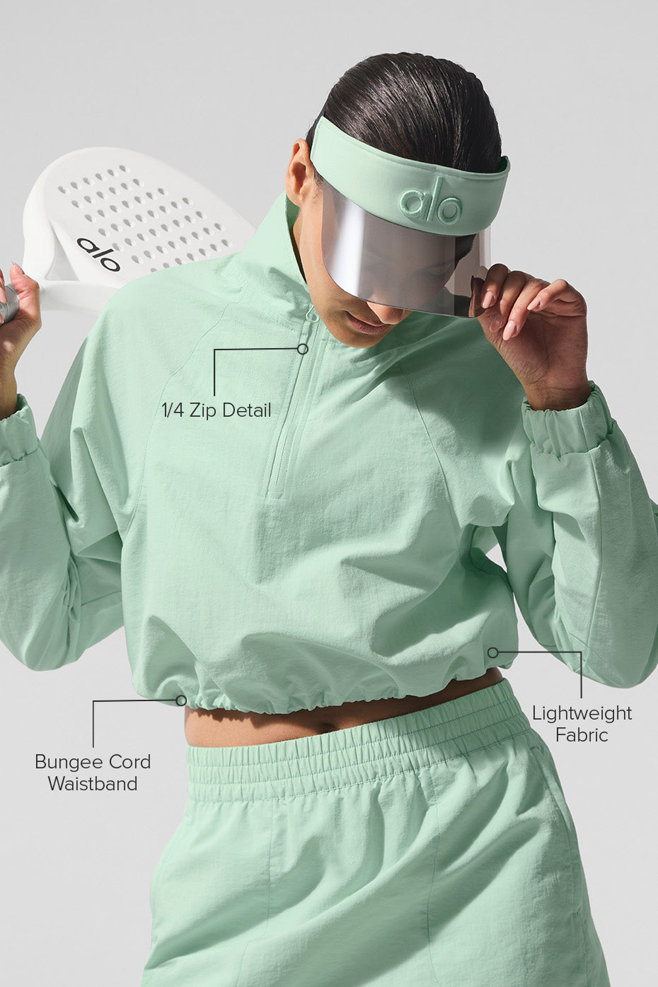 Model wearing the chic pullover with a tennis skirt.