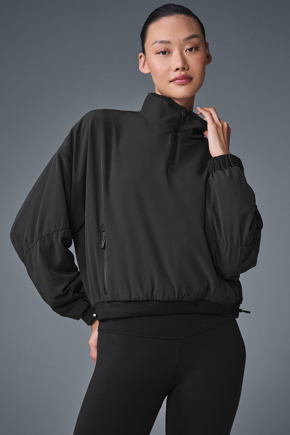 Front view of the stylish cropped puffer jacket in black.