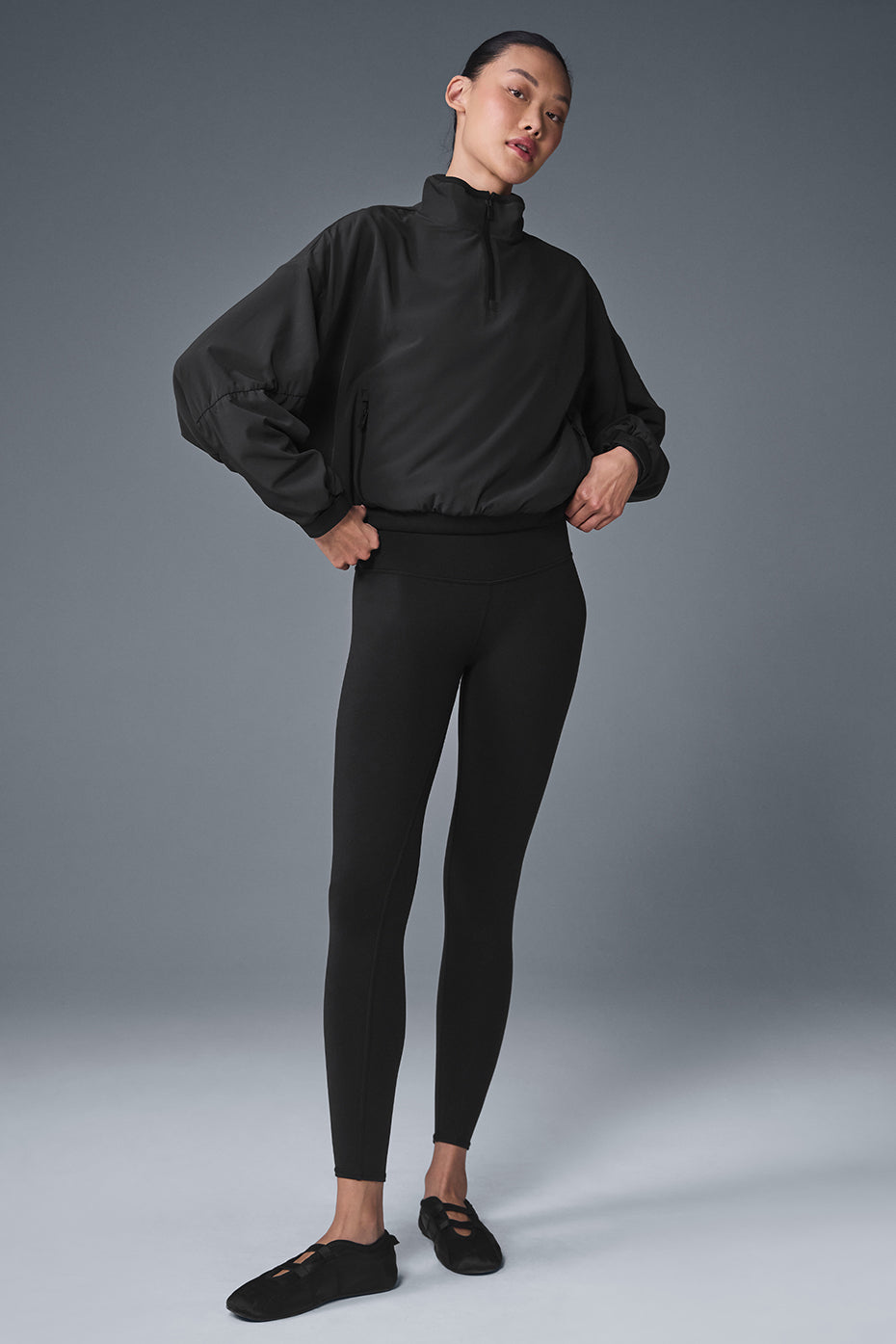 Front view of the stylish cropped puffer jacket in black.