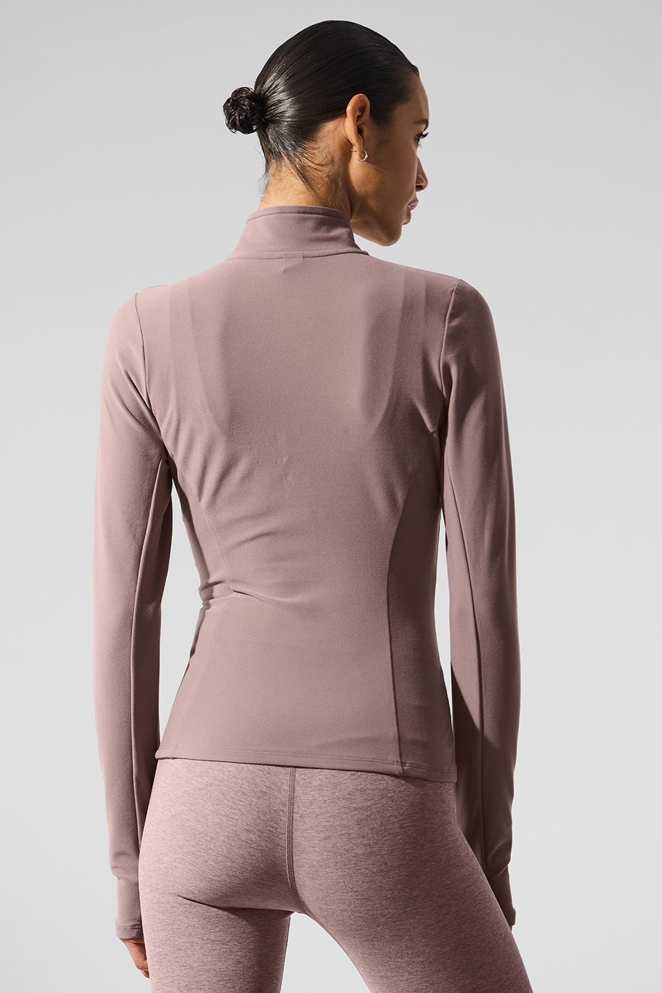 Side view showing hidden pockets on zip sweatshirt