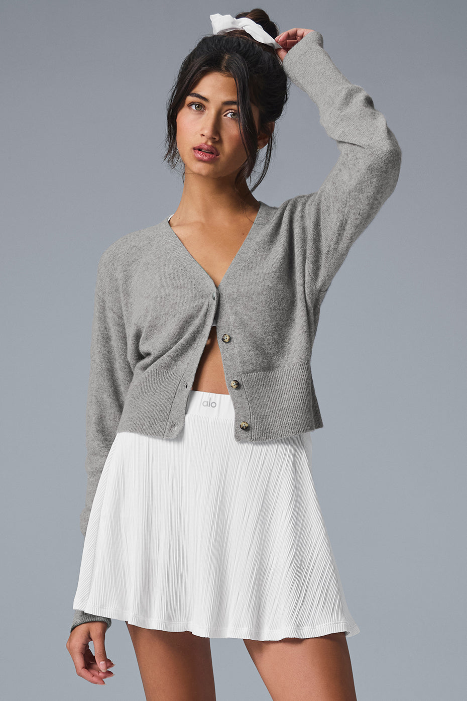 Front view of women's cashmere sweater styled with jeans for fall layering.