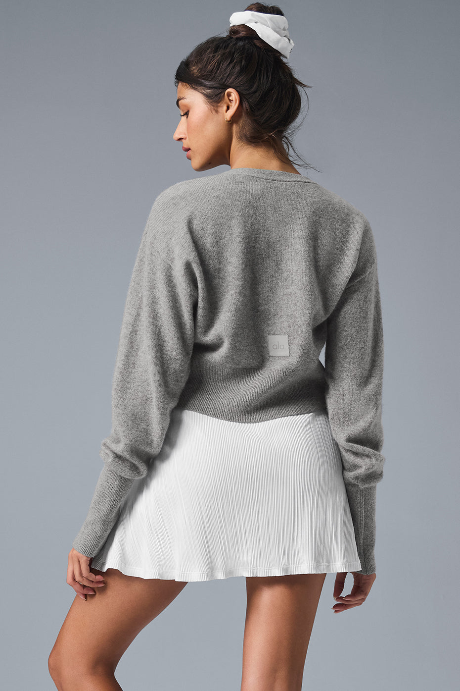 Close-up of ribbed cuffs and neckline on cashmere cardigan women love for comfort.