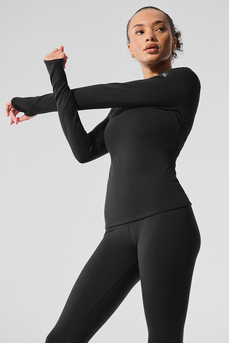 Styling the shear long sleeve top with high-waist leggings for casual outings