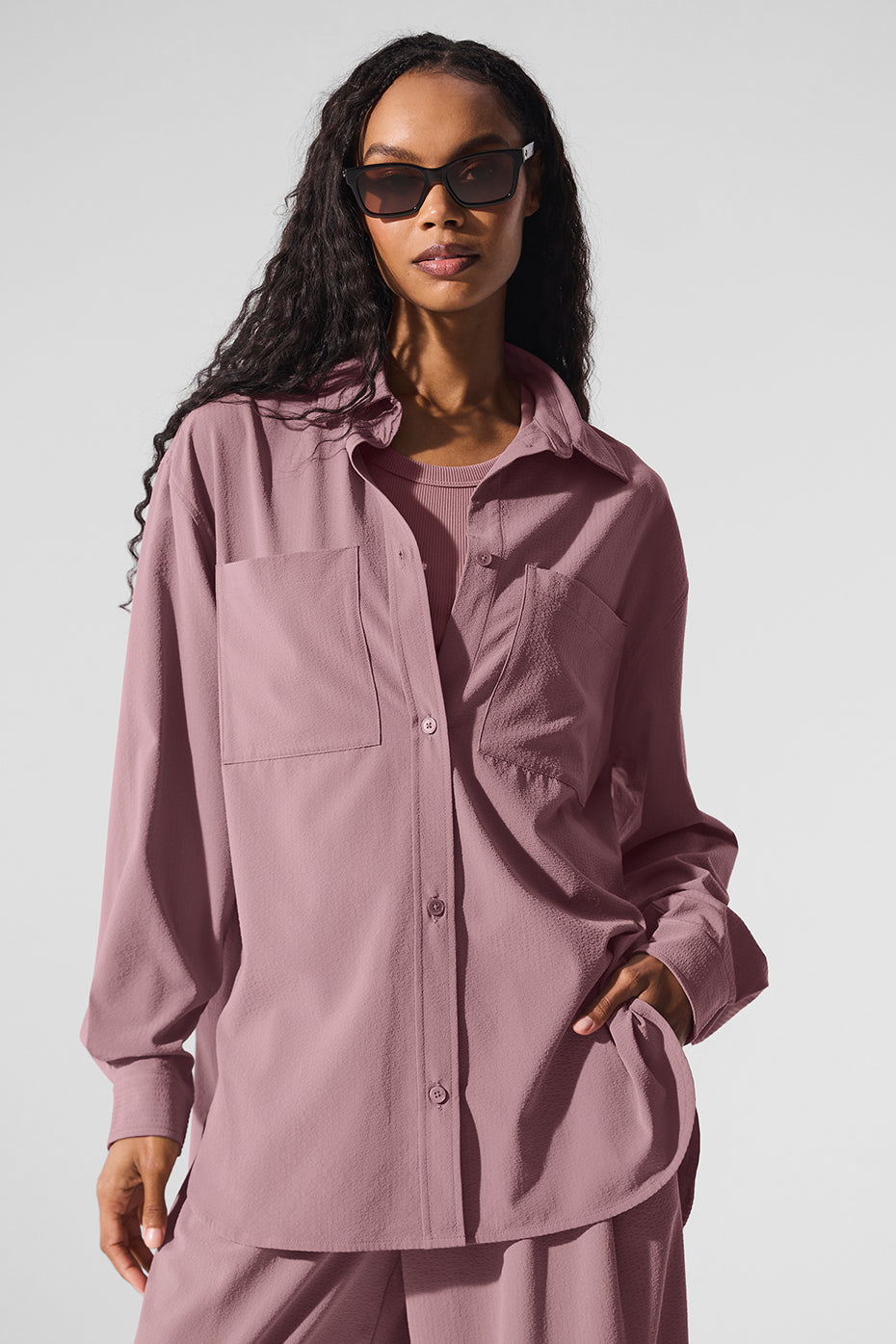 Dreamscape oversized button down shirt draped on a hanger