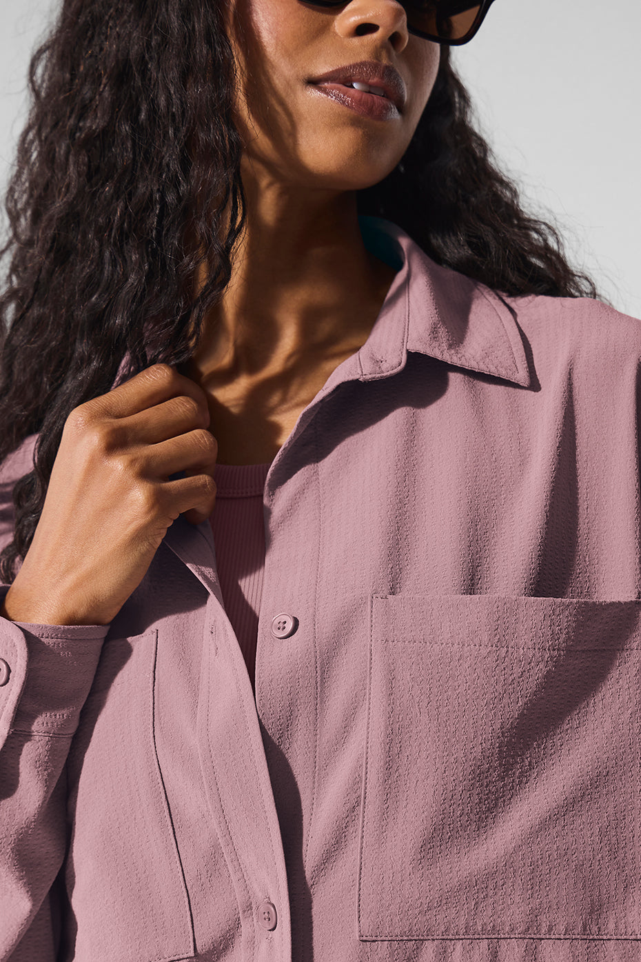 Styled with high-waist trousers for a complete look