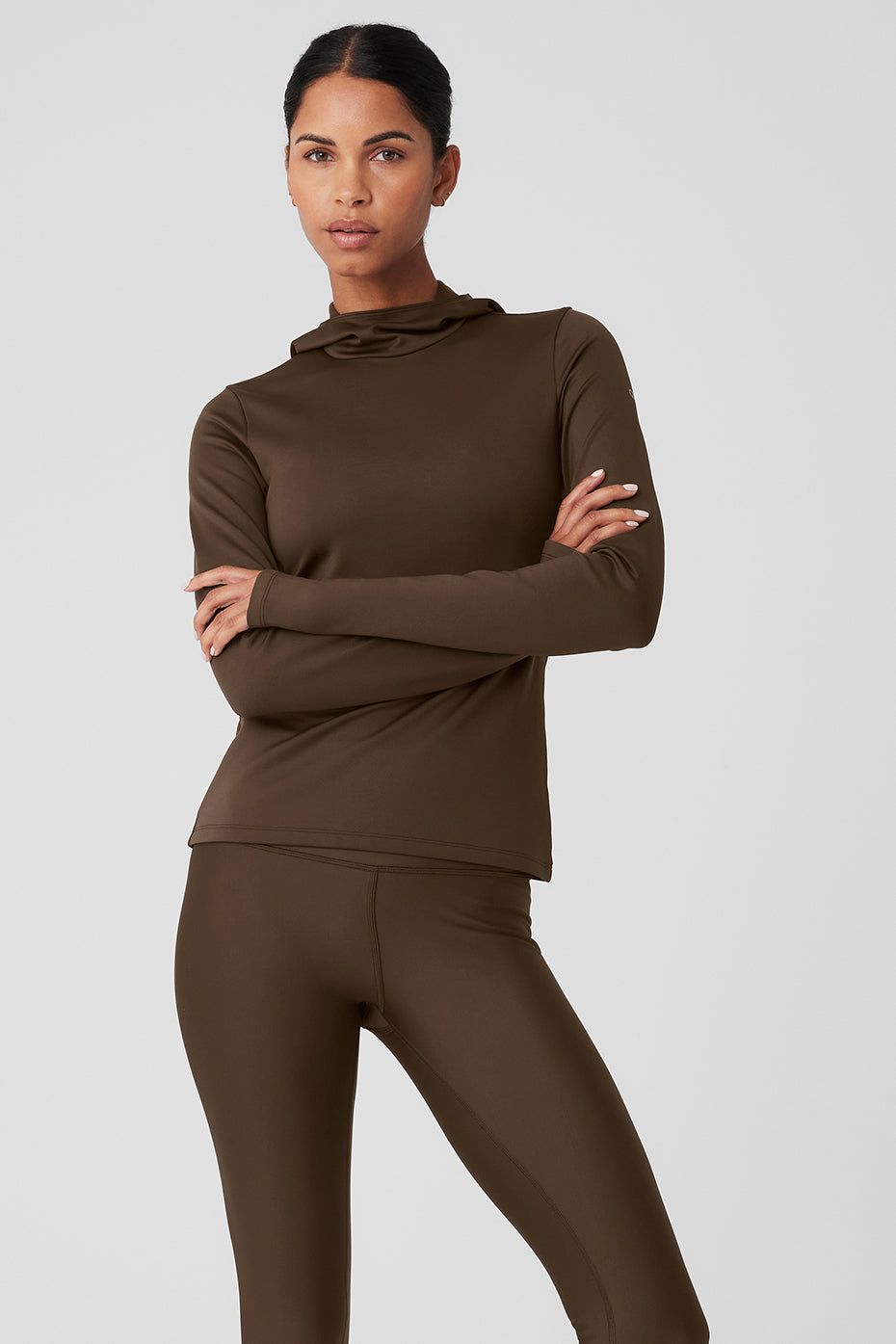 Model wearing the hooded running jacket during winter training