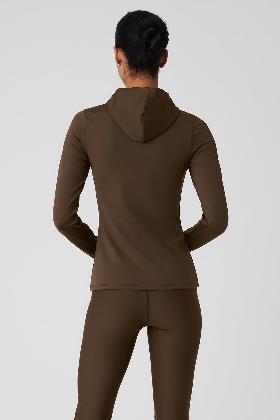 Side view of the insulated hooded running jacket on a runner
