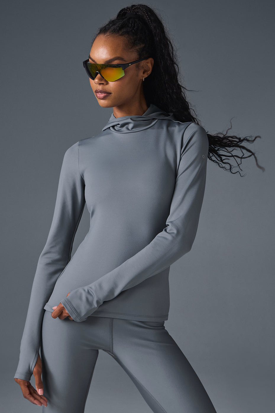 Front view of the Airlift hooded running jacket in Steel Grey, showcasing its sleek design.