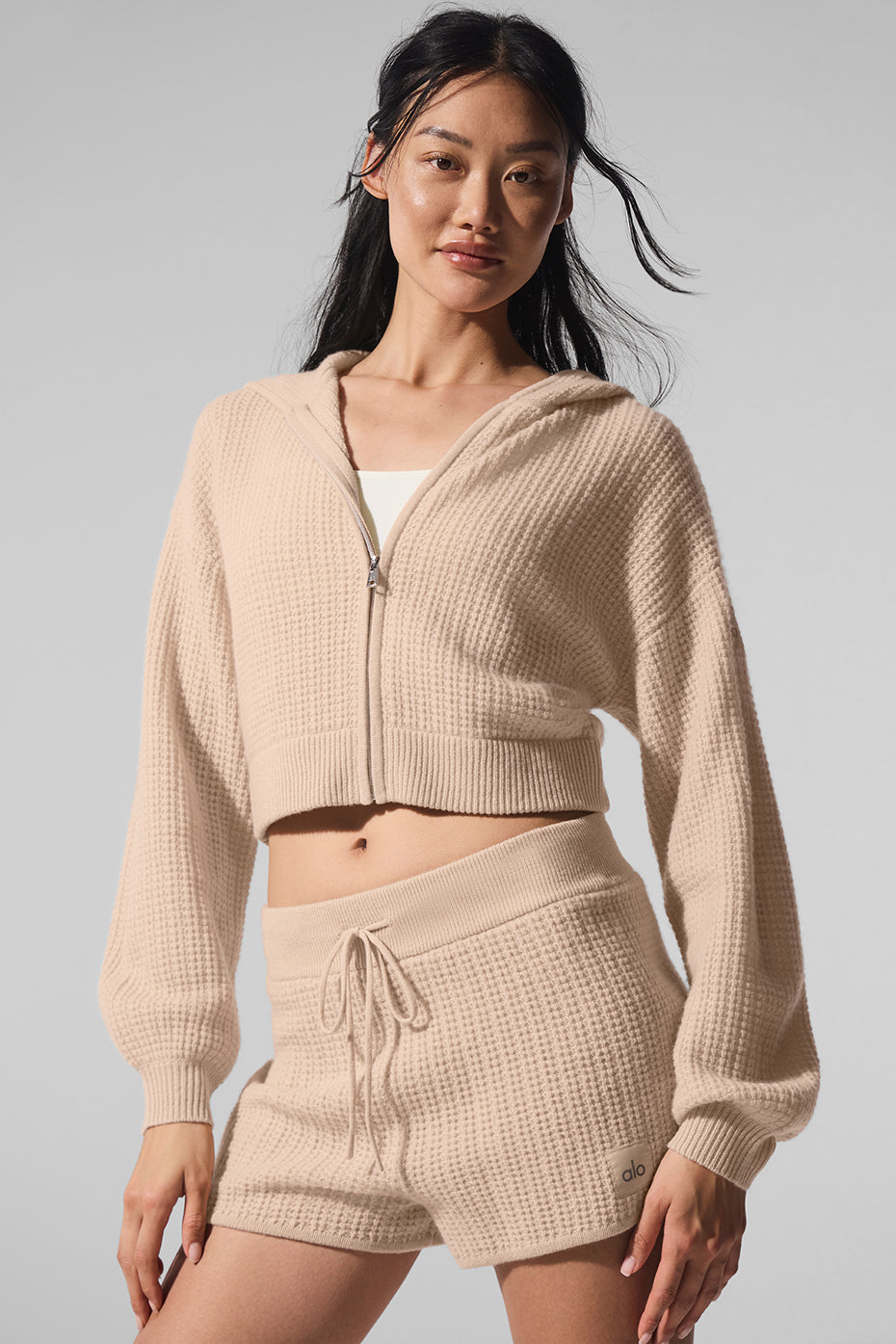 Back view of the cropped cashmere hoodie women can layer effortlessly