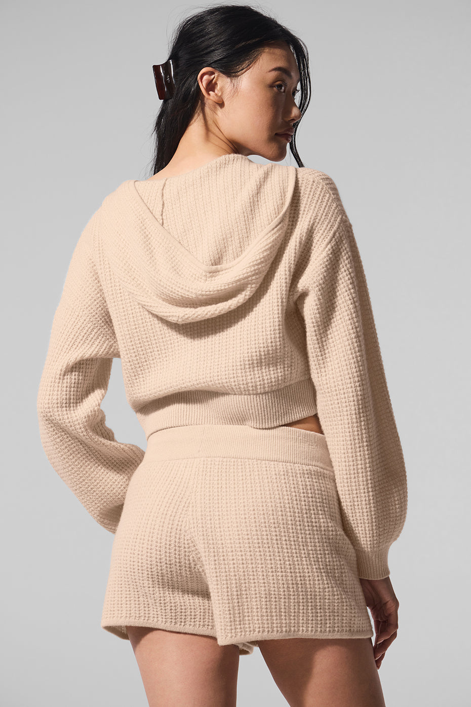 Model wearing the ladies cashmere hoodie sweater with full zip front