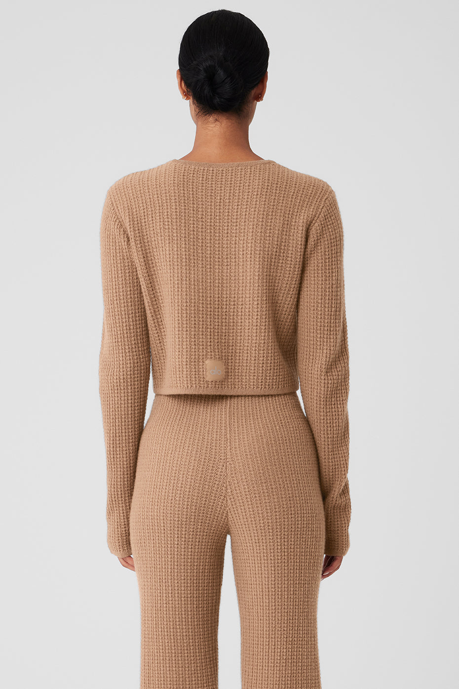Detail of waffle knit texture on the cropped sweater.