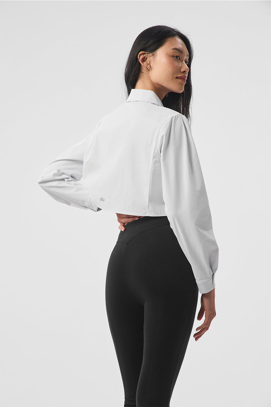 Close-up of the hidden buttons on the cropped button-up shirt for women.