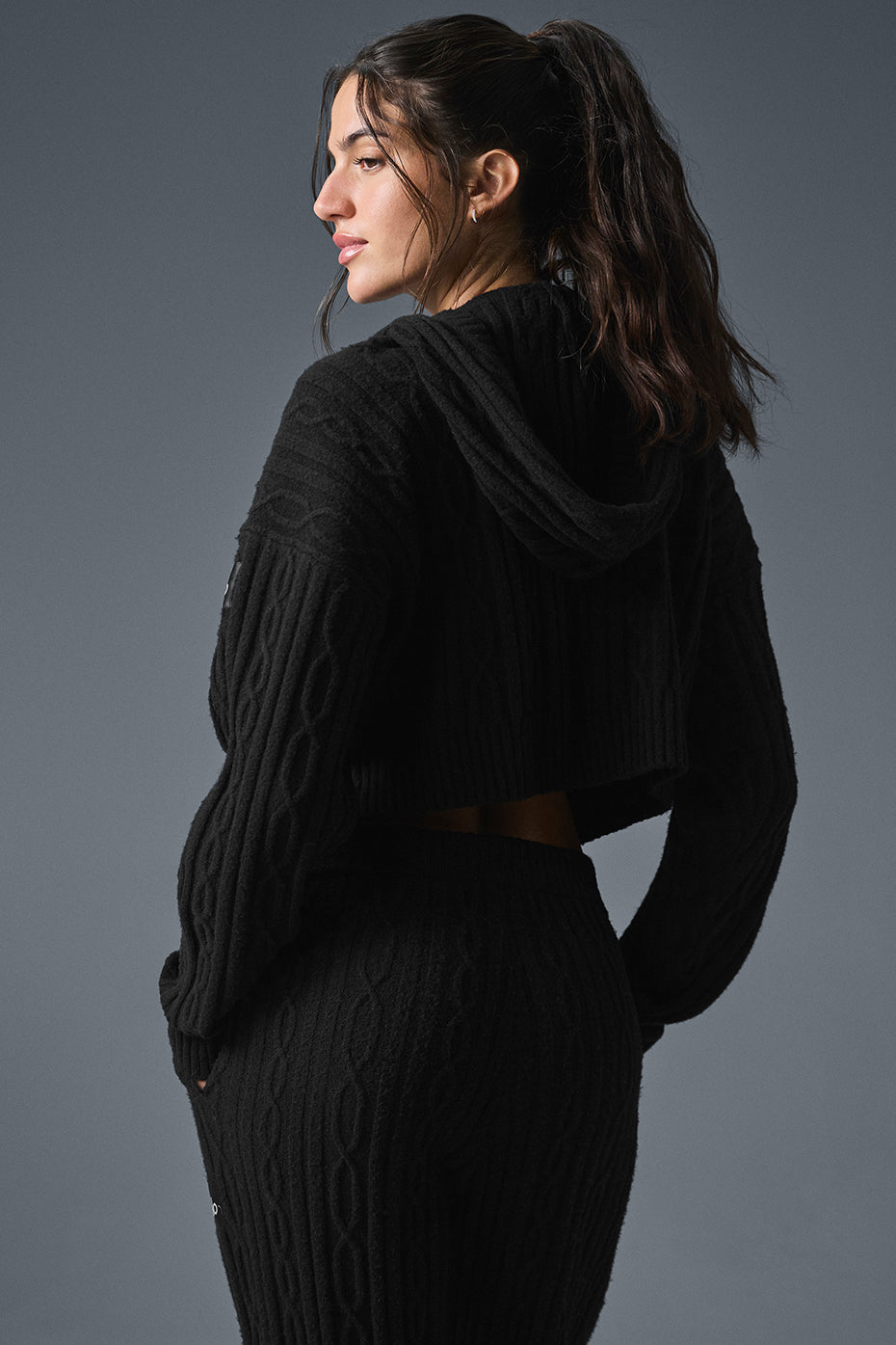 Model wearing the cozy hoodie with matching pants, ideal for winter outings.