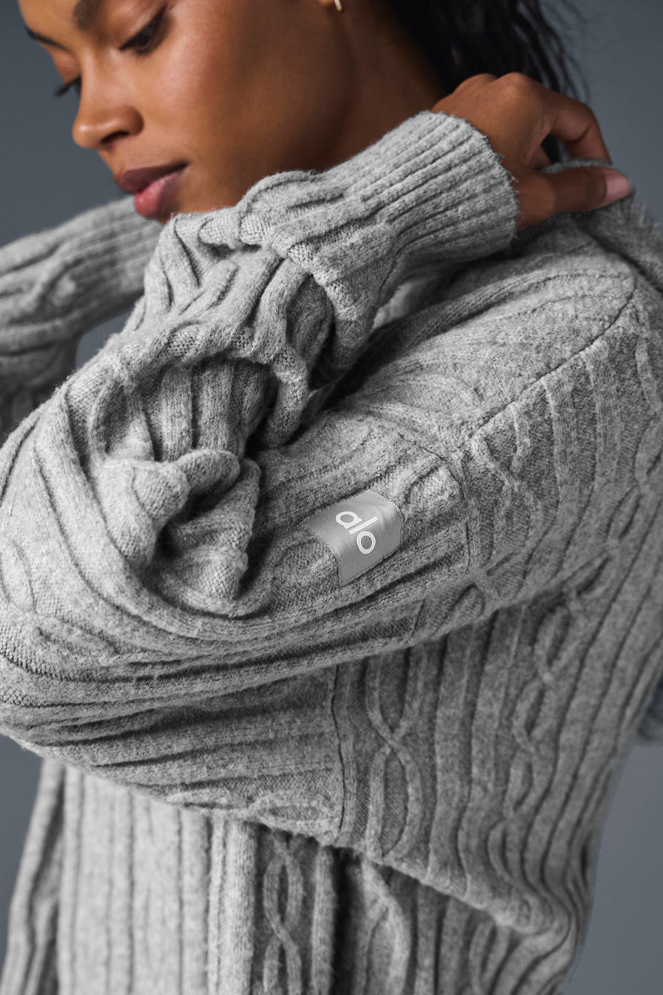 Model wearing russell athletic hoodie with layered winter outfit.