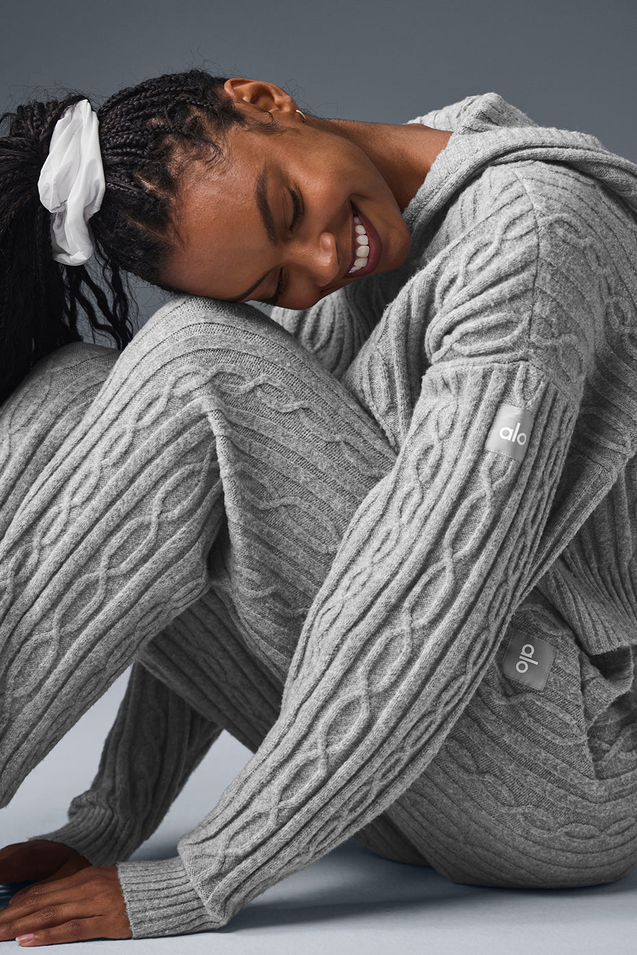 Model wearing russell athletic hoodie with layered winter outfit.