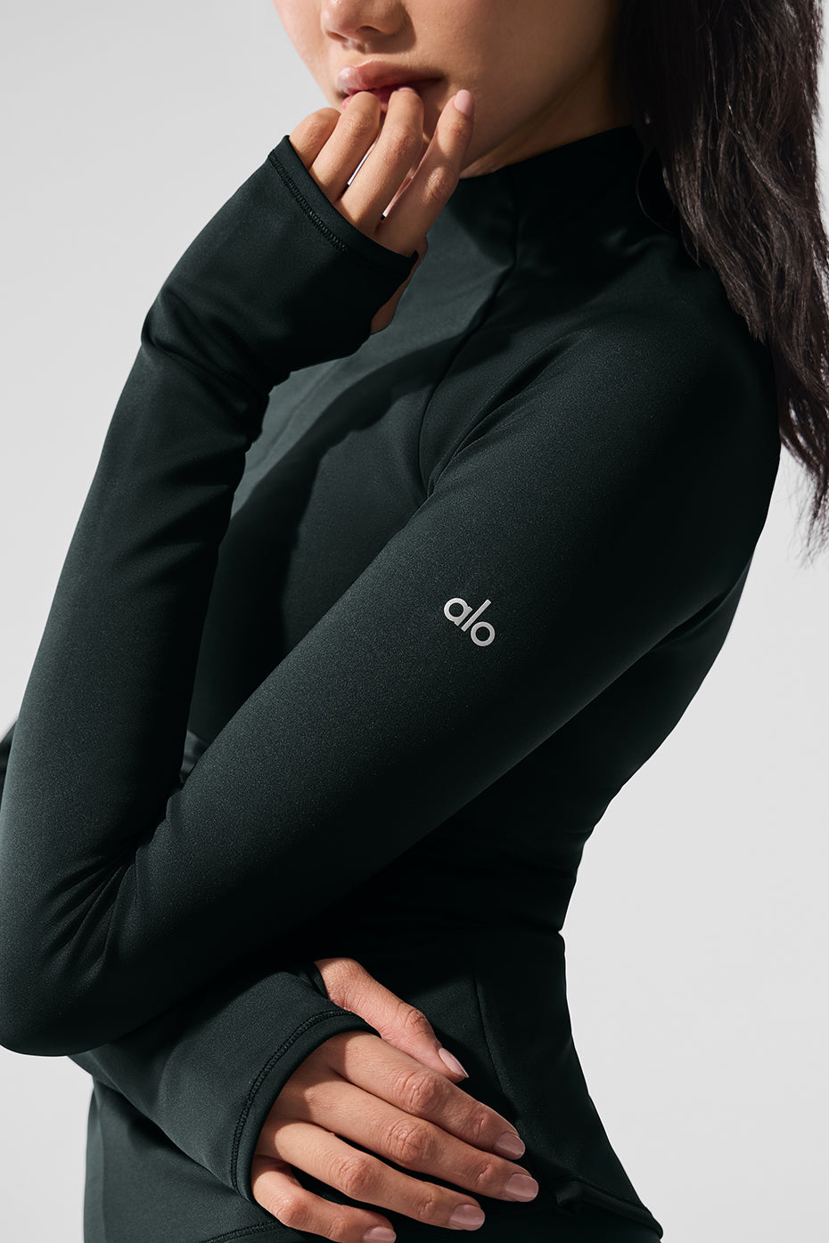 Model wearing the womens quarter zip top during a winter outdoor workout.