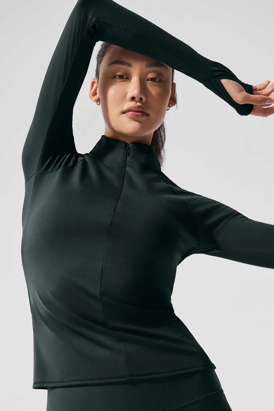 Airlift womens quarter zip top in charcoal green, showcasing the quarter-zip design.
