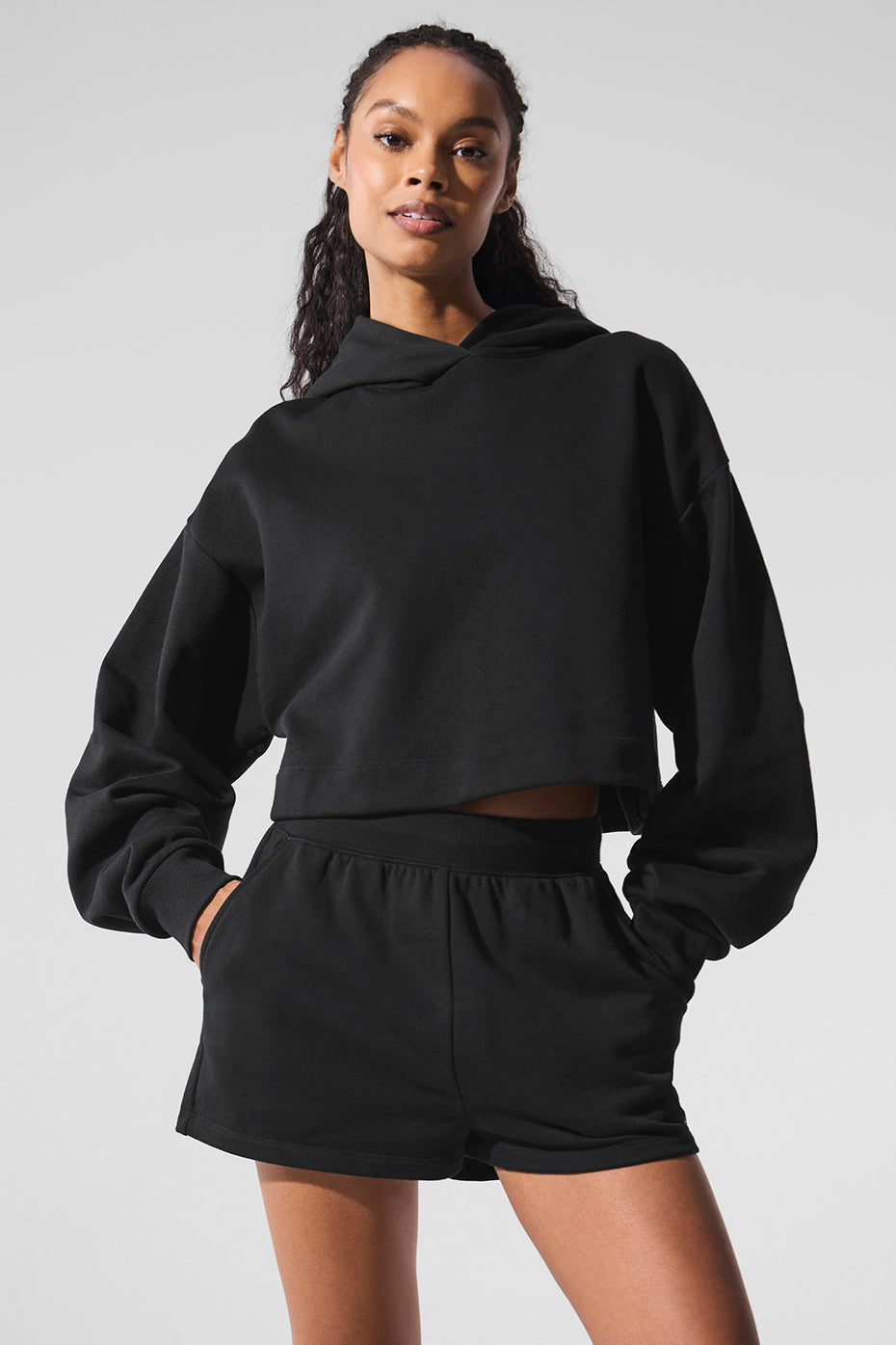 Black comfort hoodie worn with jeans, showcasing relaxed fit.