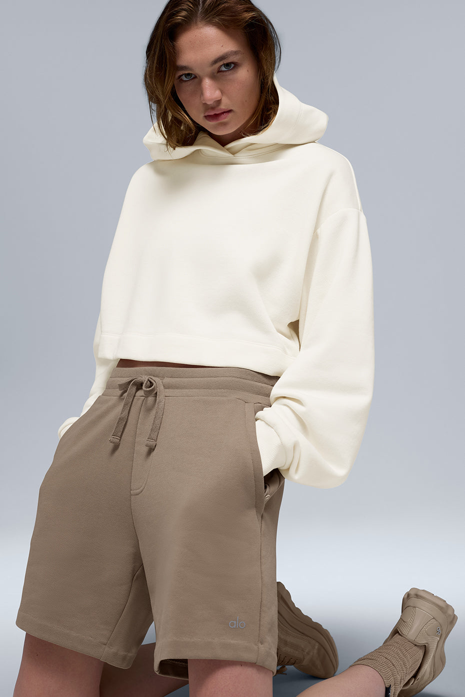Side angle showing relaxed fit and scrunchable sleeves of the hoodie