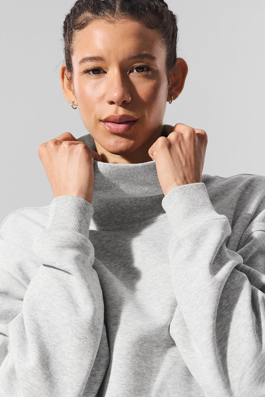Detail of cozy fabric and mock neck design on the pullover sweater