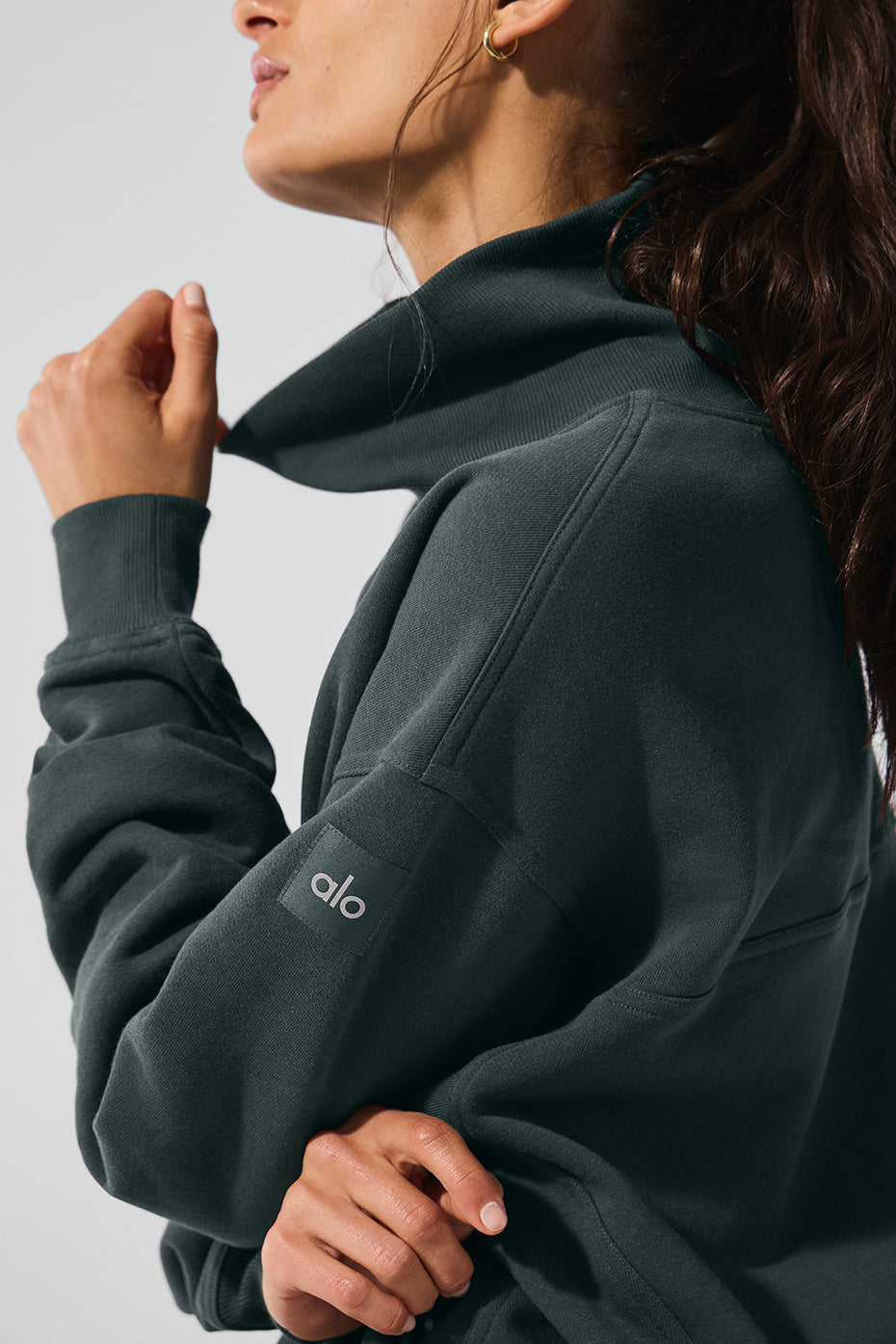 Close-up of mock neck pullover detailing and plush cotton texture.