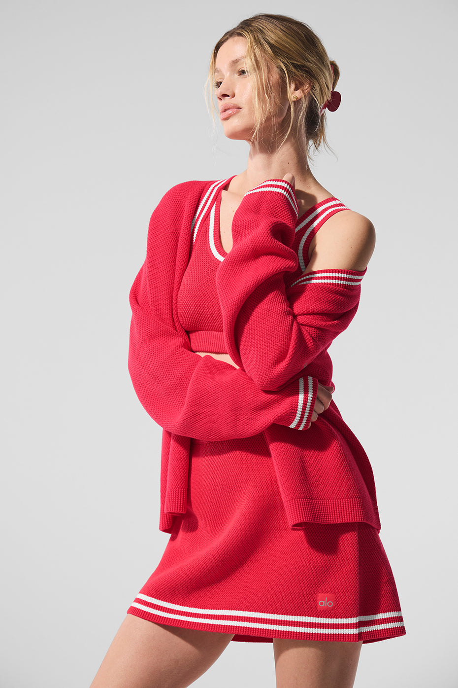 Close-up of the ribbed cuffs and four-button front of the cardigan.