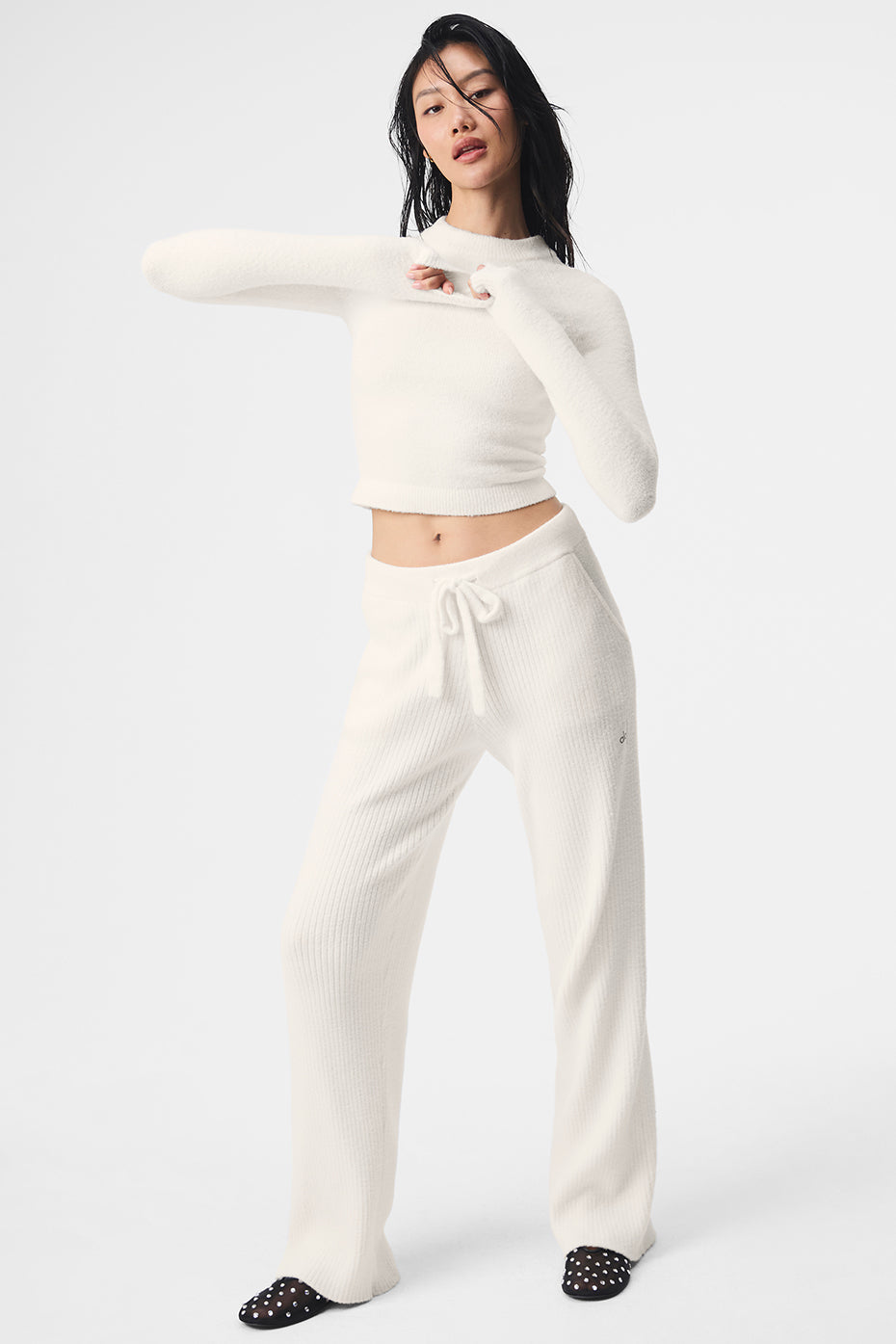 Model showcasing the ivory cropped sweater paired with matching pants.