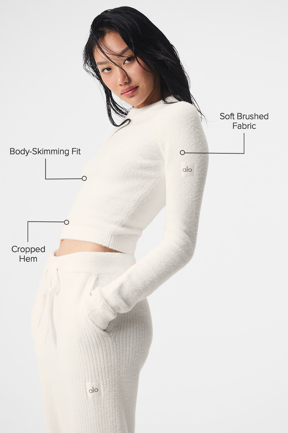 Model showcasing the ivory cropped sweater paired with matching pants.