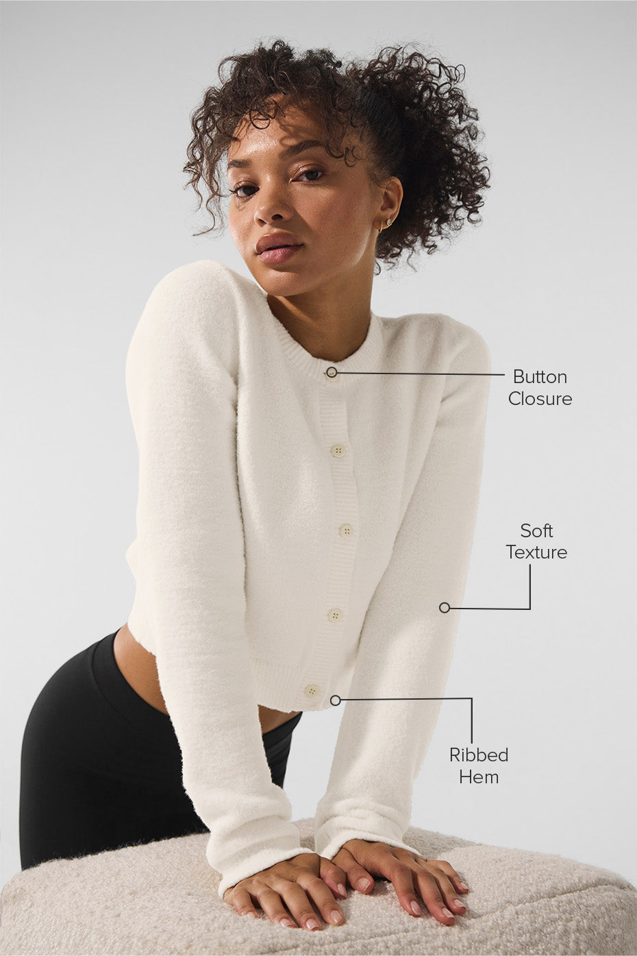 Detail shot of womens black sweater texture and stitching
