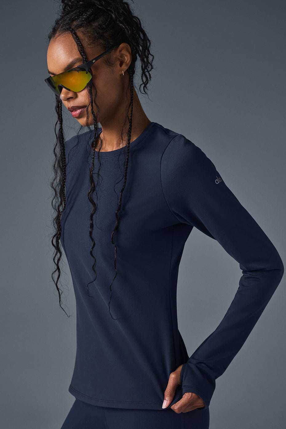 Model wearing the navy long sleeve crop top during a winter walk.