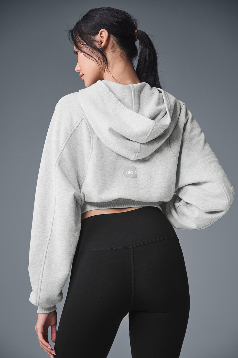Front view of the zip up hoodie highlighting the streamlined fit and hood