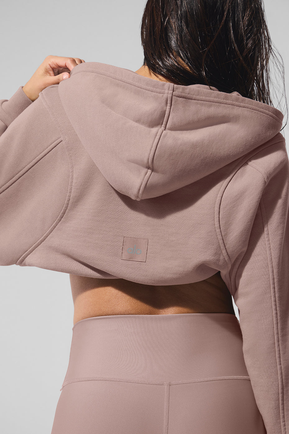 Side angle of the cozy hoodie, highlighting the ribbed cuffs and hem.