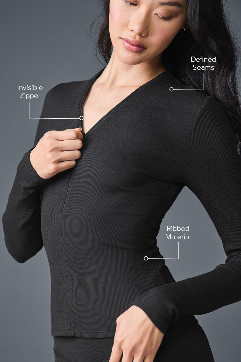 Model wearing the black long sleeve shirt, styled with jeans for a casual look.