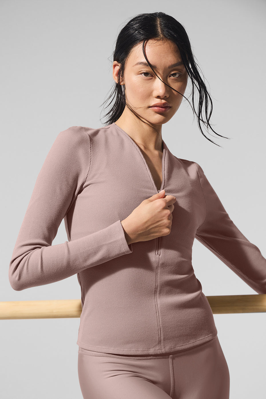 Taupe ribbed mesh long sleeve top styled with high-waisted jeans