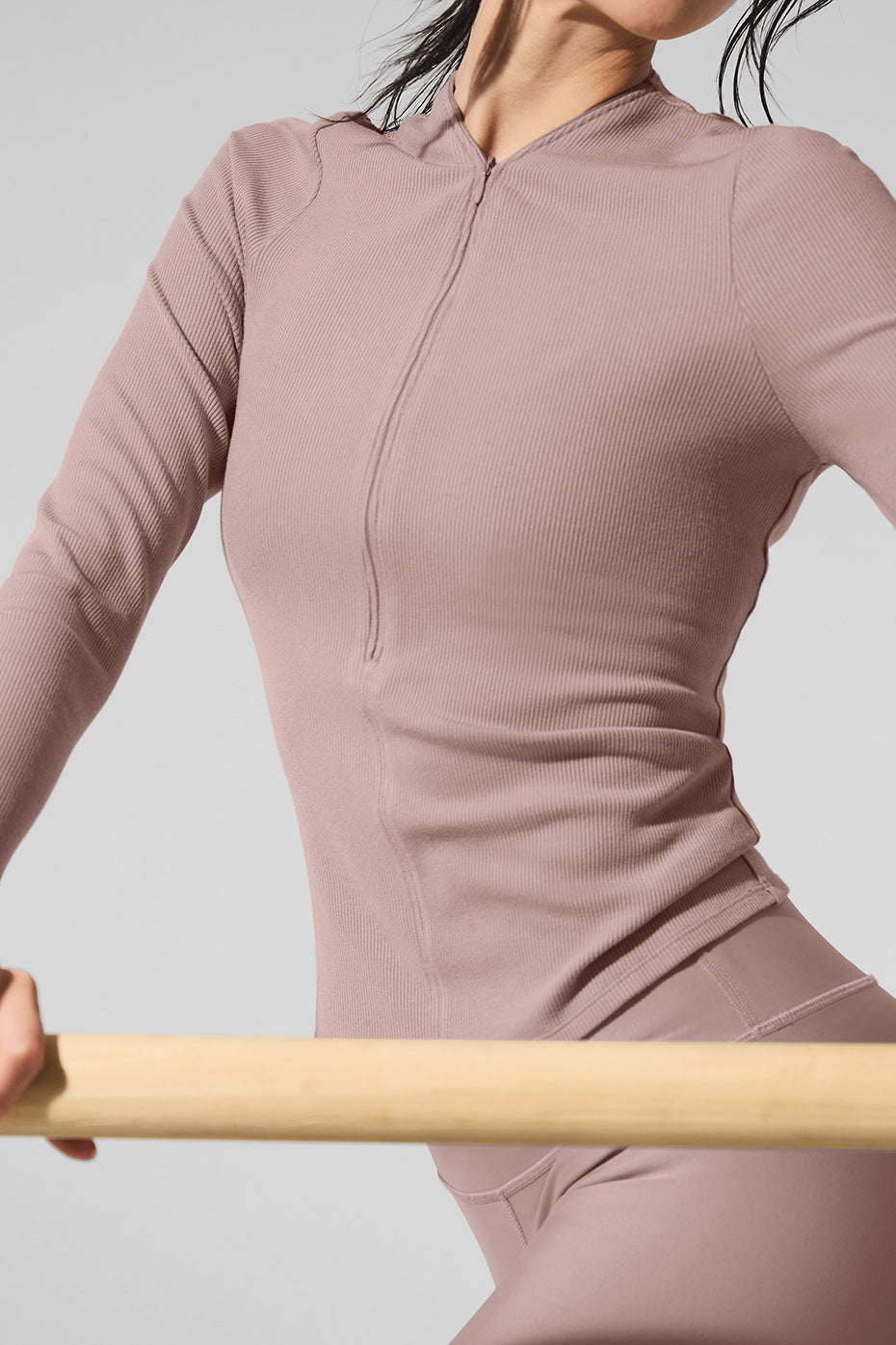 Close-up of adjustable V-neck zipper detail on sheer fabric