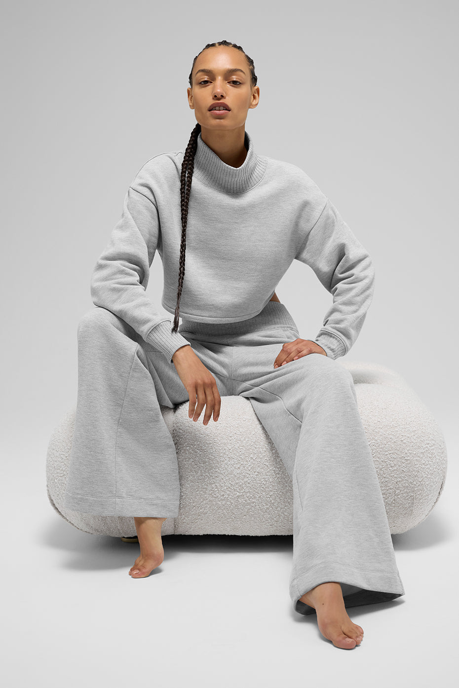 Closeup of ribbed mock neck and heather grey fabric texture