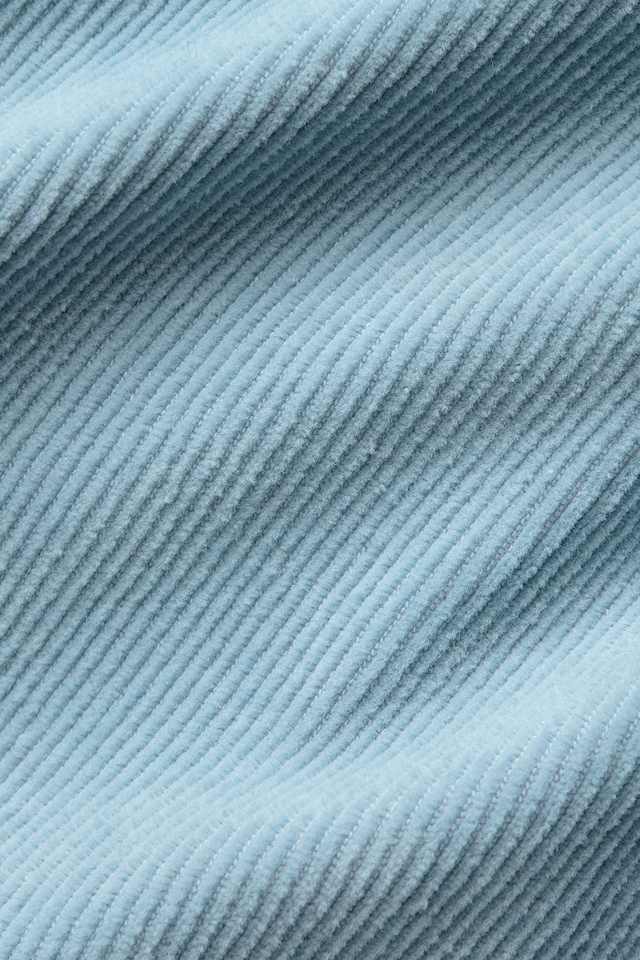 Close-up of the celestial blue top showcasing its corduroy texture.