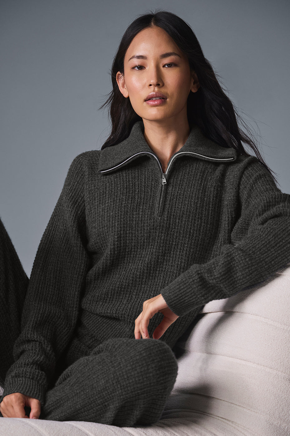 Close-up of the black cashmere pullover sweater showcasing its soft texture.