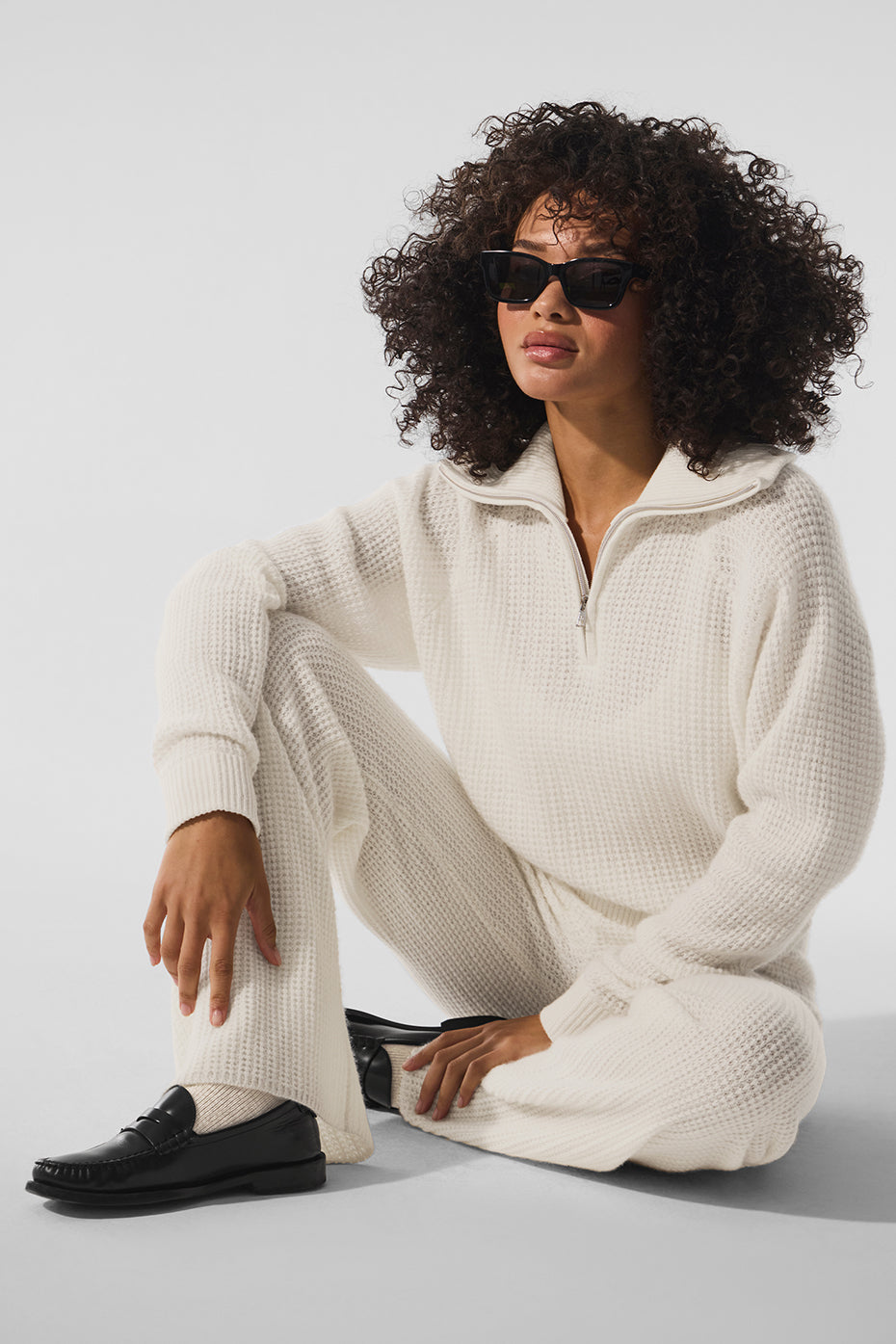 Close-up of ivory cashmere quarter zip women's pullover showing texture detail