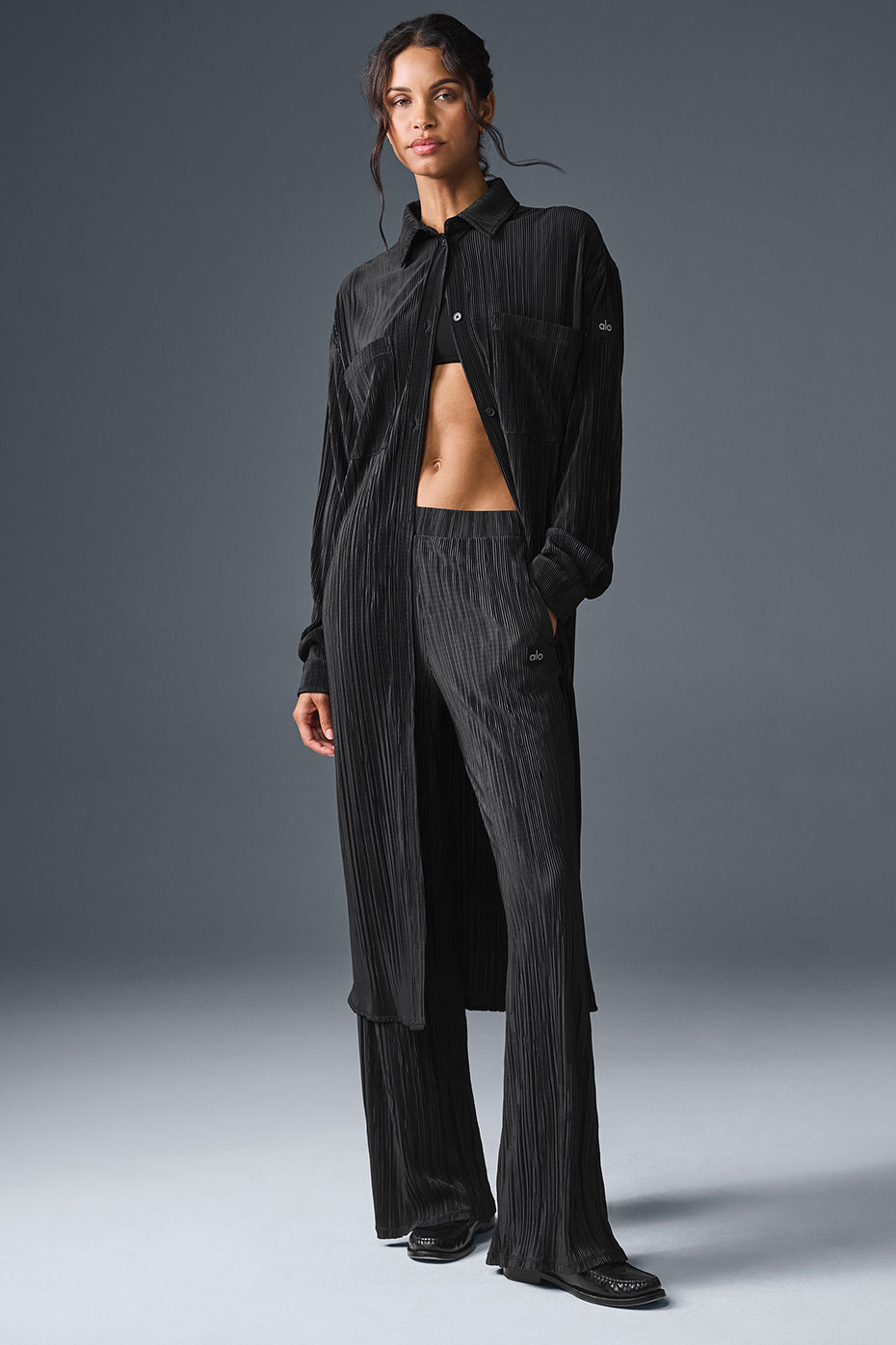 Chic black plisse shirt dress styled with accessories.