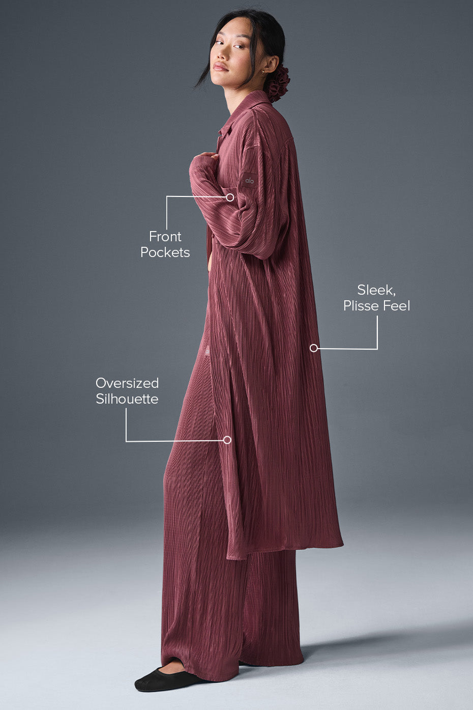 Side view showcasing the flowy design of the burgundy dress.