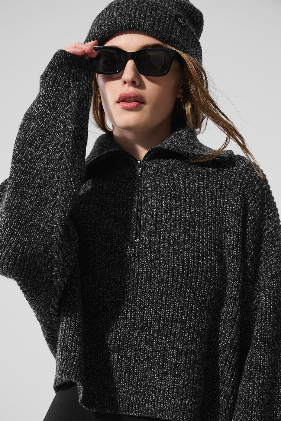 Front view of the black marl quarter zip pullover sweater, showcasing its boxy fit.