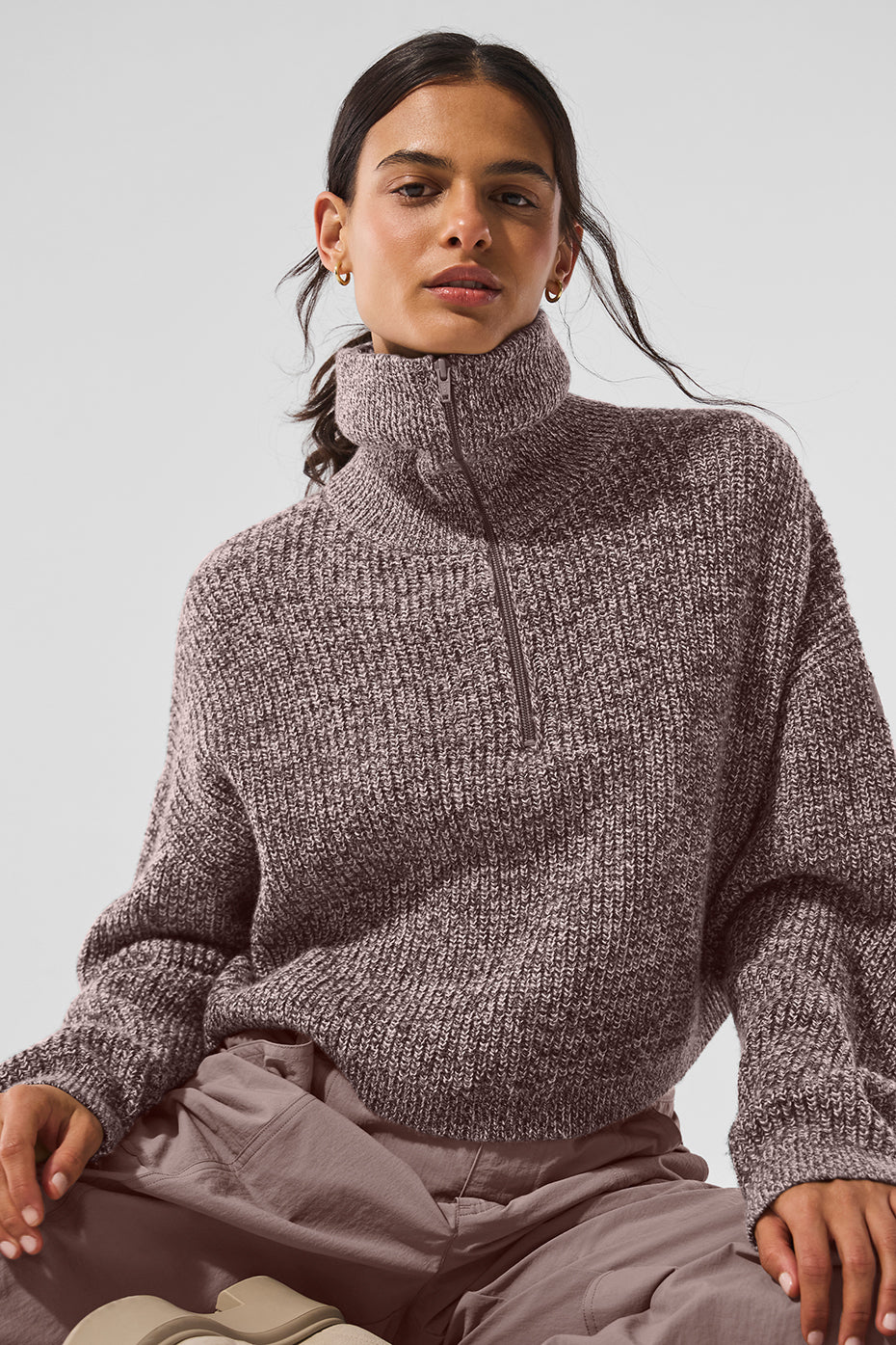 Close-up of the exaggerated collar on the cropped turtleneck sweater.