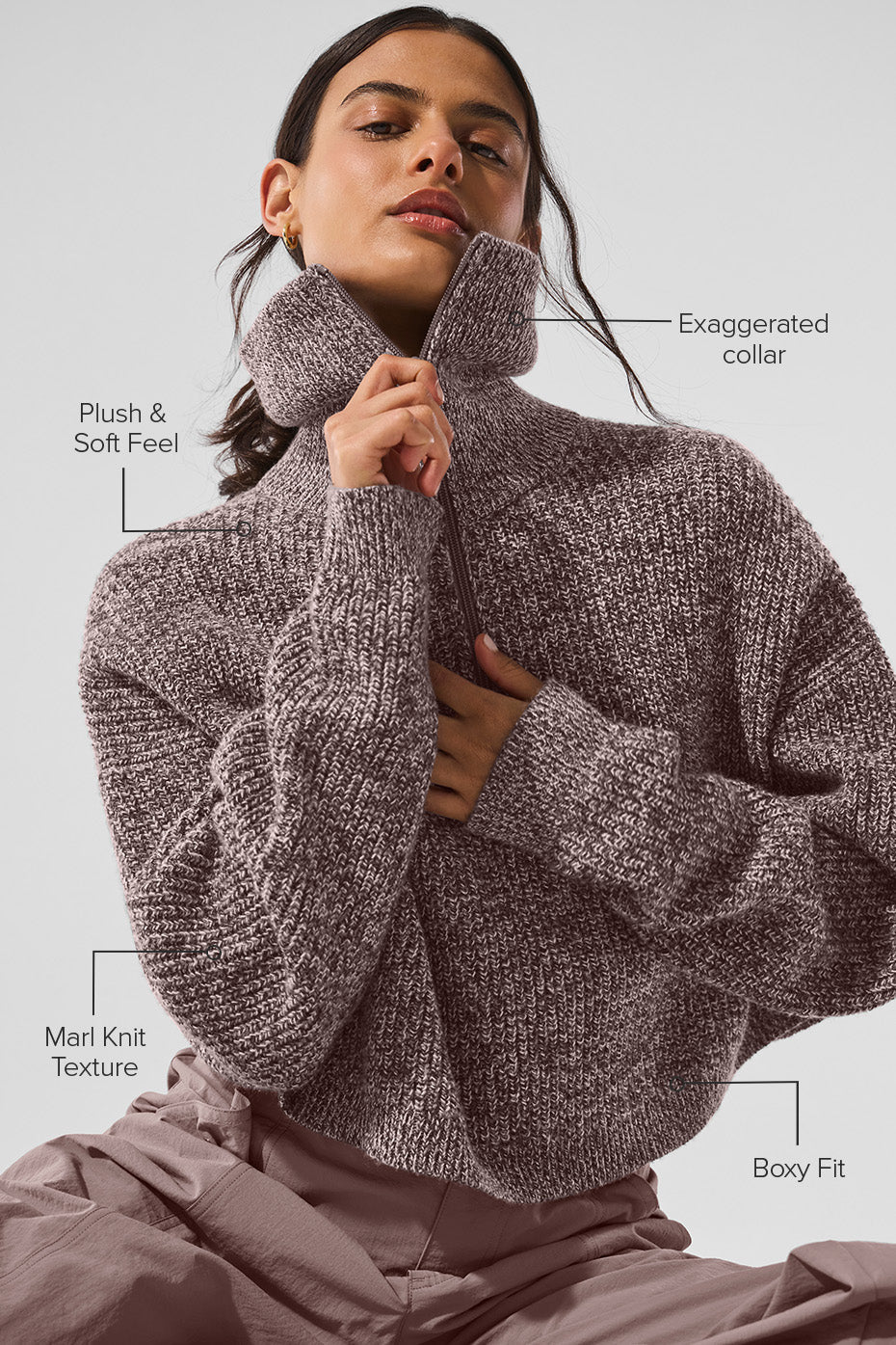 Model wearing the quarter zip pullover sweatshirt with casual bottoms.