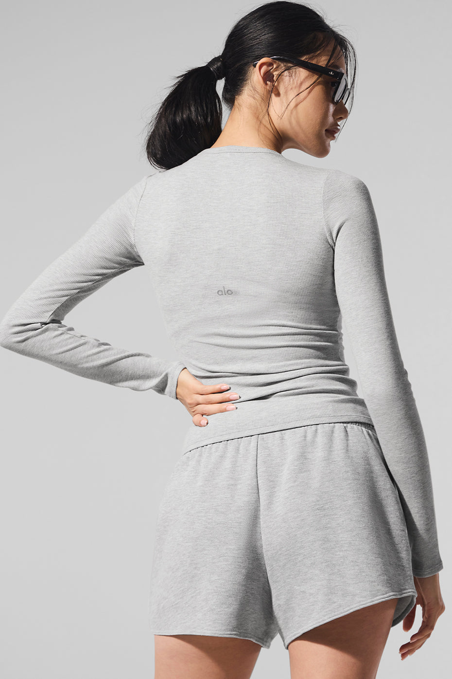 Close-up of the fabric texture of the black long sleeve shirt.