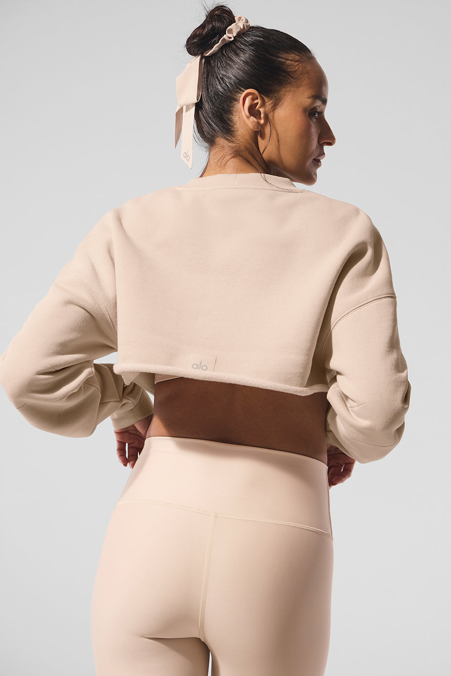 Front view of the Extreme Cropped Pullover in Macadamia color, styled for casual and tennis outfits
