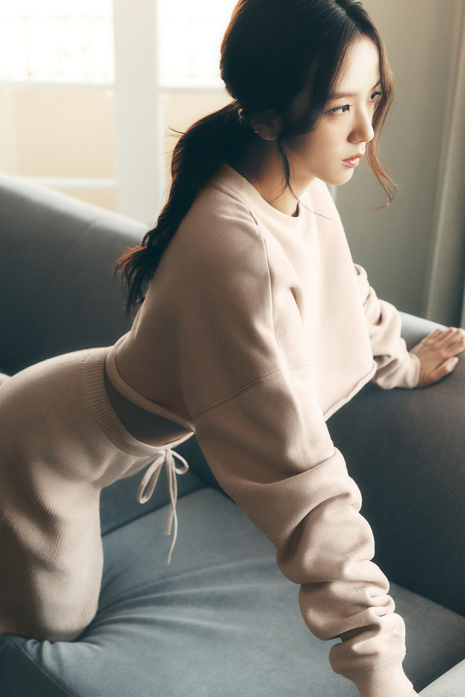 Front view of the Extreme Cropped Pullover in Macadamia color, styled for casual and tennis outfits
