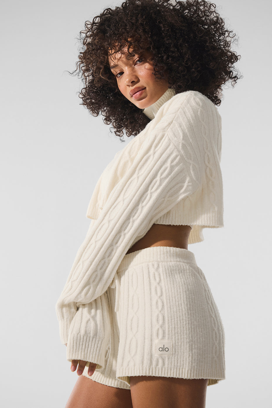 Front view of chic black turtleneck sweater for winter fashion.