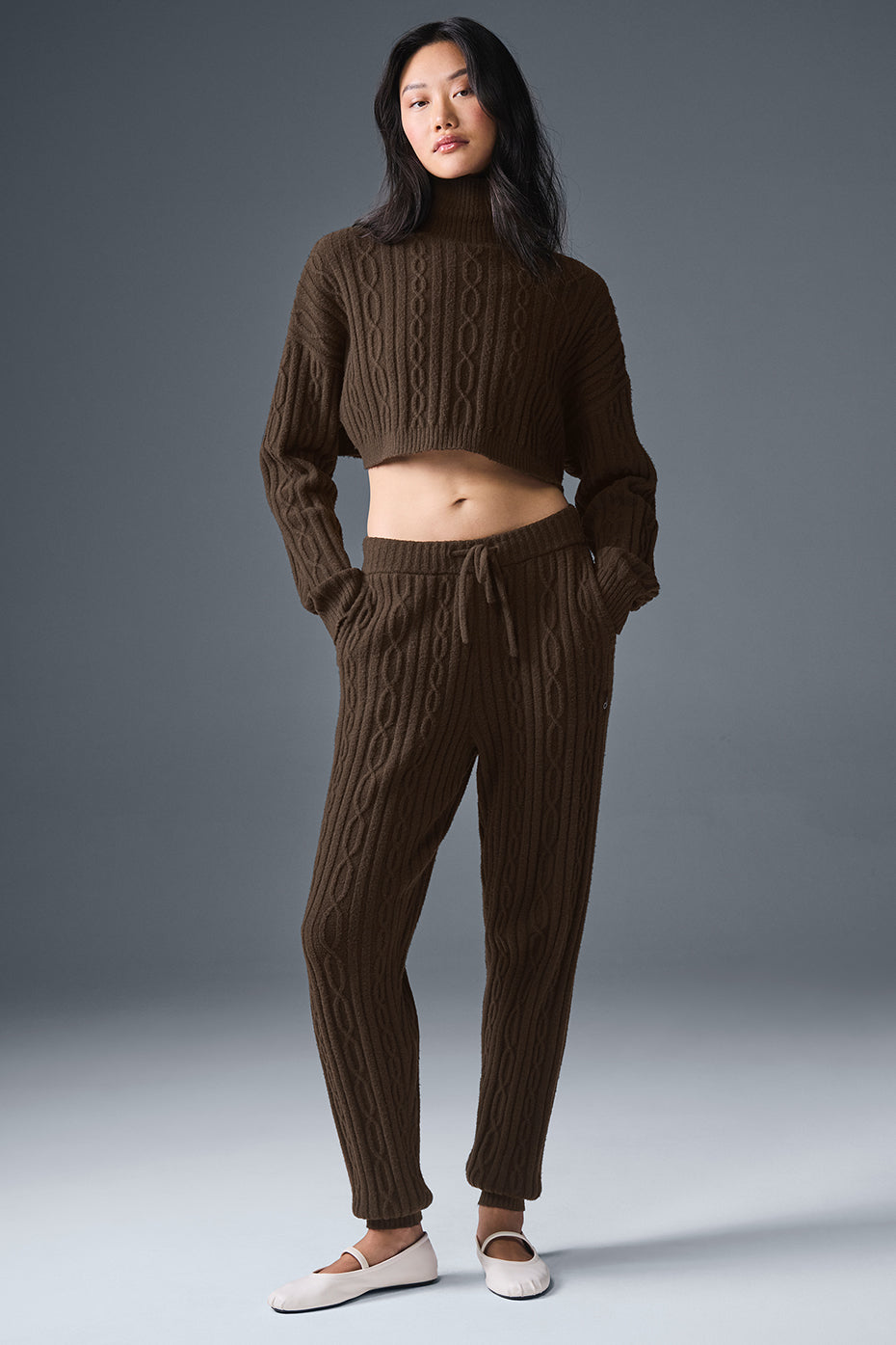 Back view of turtleneck sweater draped over shoulders