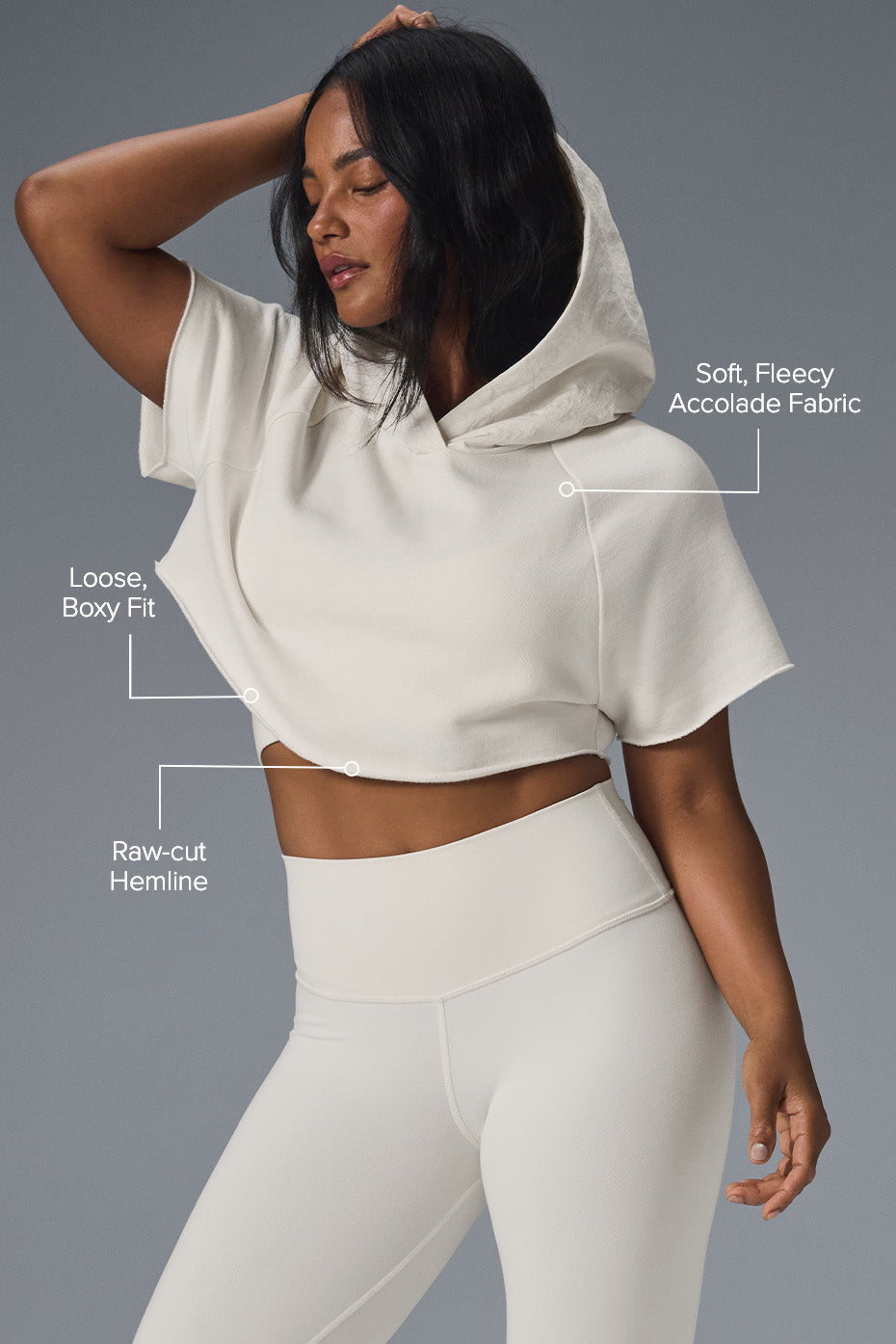 Model wearing cropped hoodie with high-waisted leggings.
